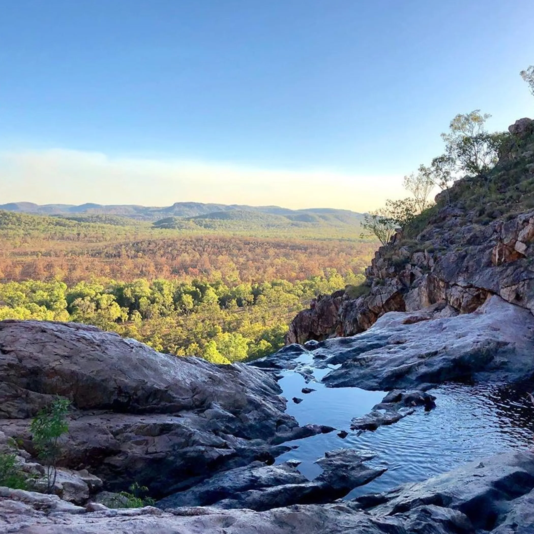 tourist viewing kakadu waterfalls monsoon season